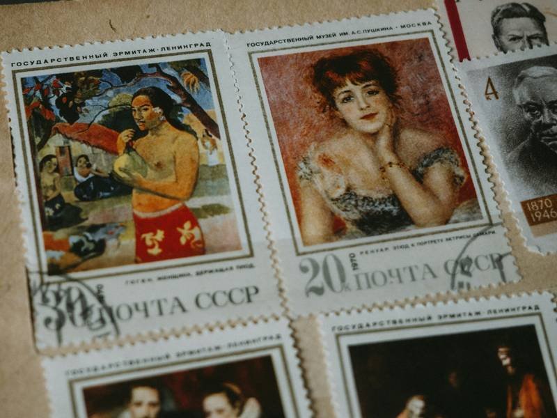 a bunch of stamps with pictures of people on them